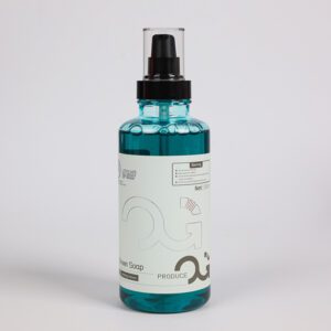 Clear bottle of blue liquid soap with a pump dispenser.