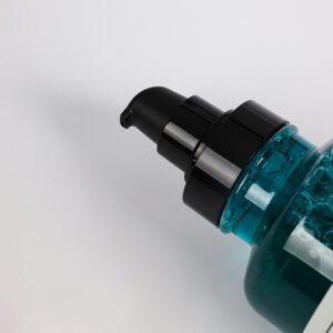Close-up of a blue pump bottle on a white background.