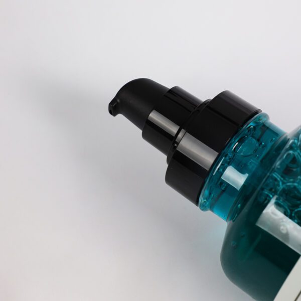 Close-up of a blue pump bottle on a white background.