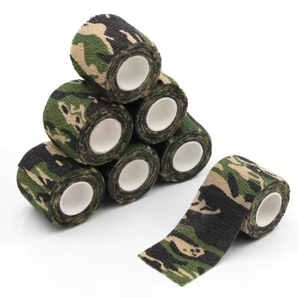 Six rolls of camouflage-patterned tape stacked, one unrolled.