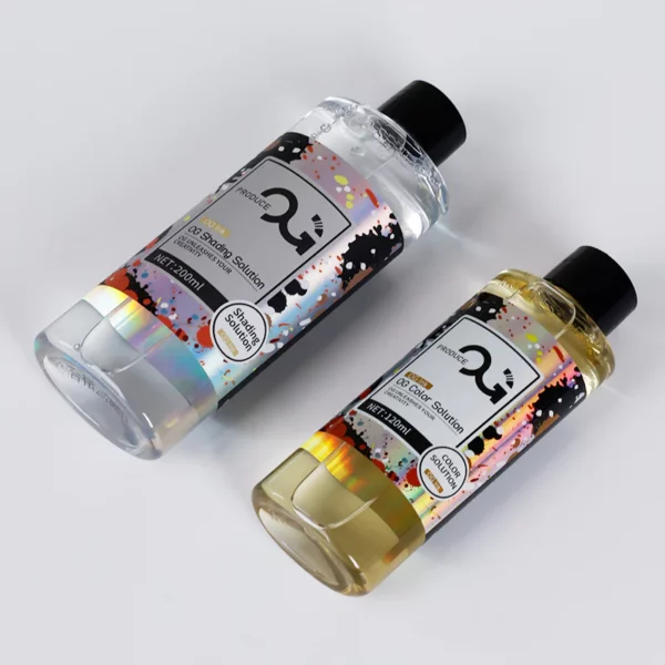 Two bottles of hair dye solution on a gray background.