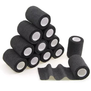 Black cohesive bandage rolls stacked in a pyramid shape.