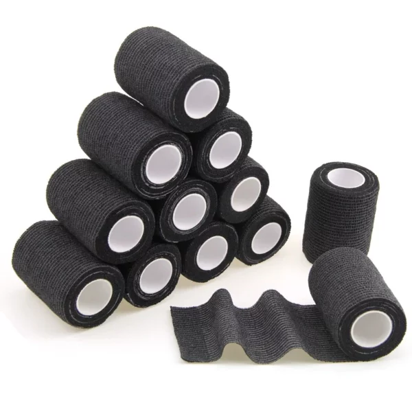 Black cohesive bandage rolls stacked in a pyramid shape.
