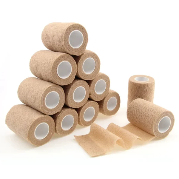 Stack of beige medical bandage rolls, some unrolled.