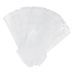 Stack of clear plastic bags fanned out on a white background.